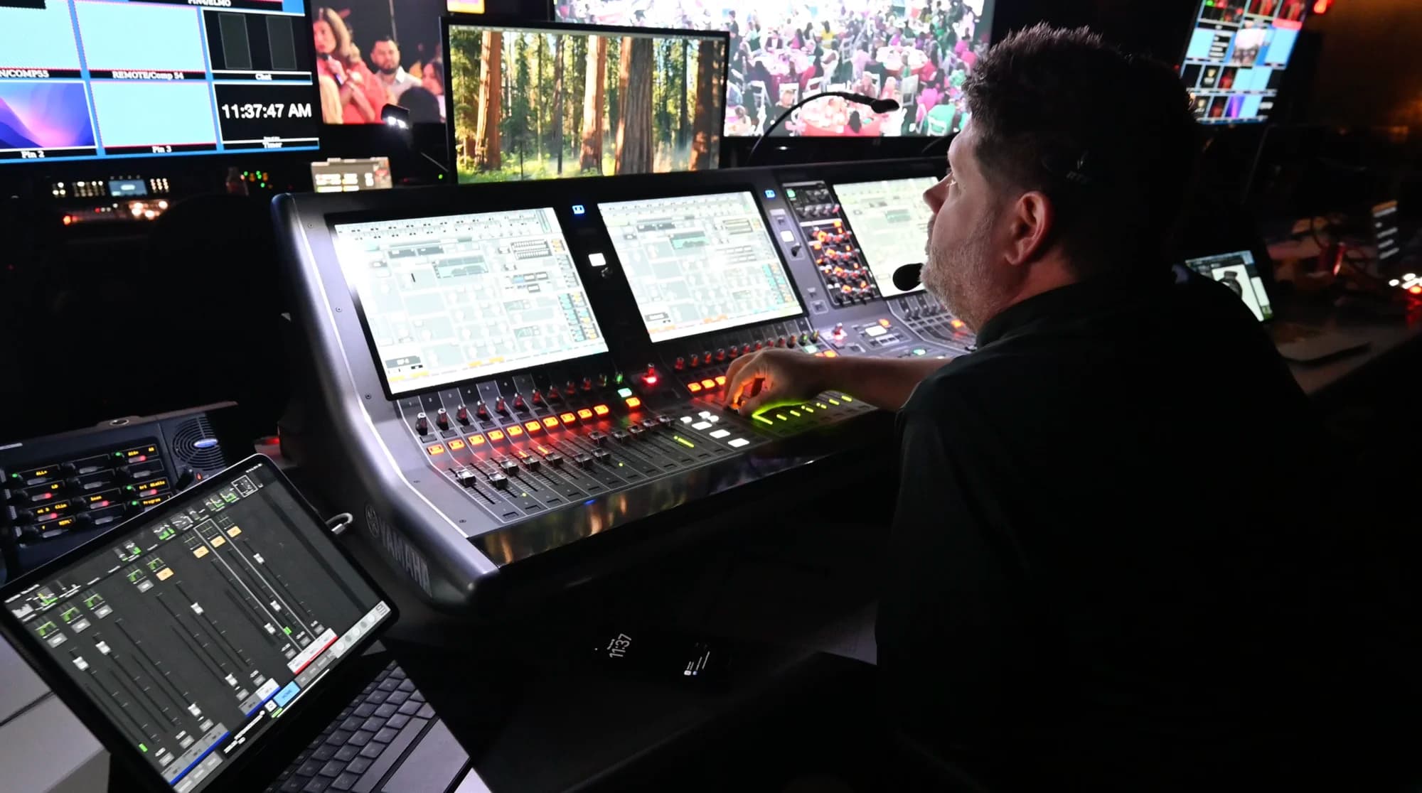 A Worre Studios audio engineer mixing a live show at a Yamaha console.